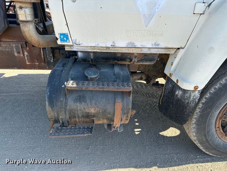 image for item ES1024 1985 Ford L7000 hook lift truck with tank