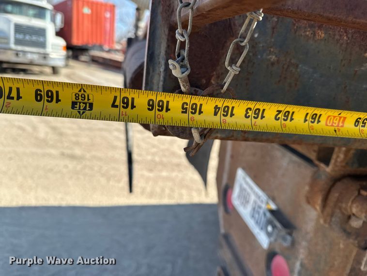 image for item ES1024 1985 Ford L7000 hook lift truck with tank