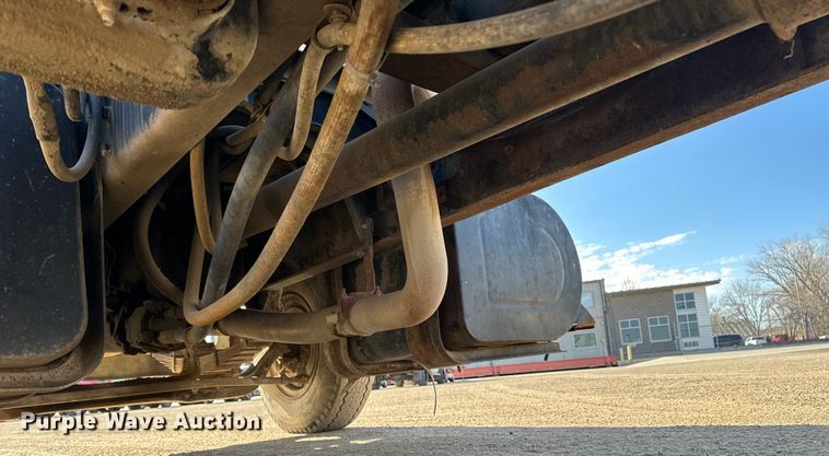 image for item ES1024 1985 Ford L7000 hook lift truck with tank