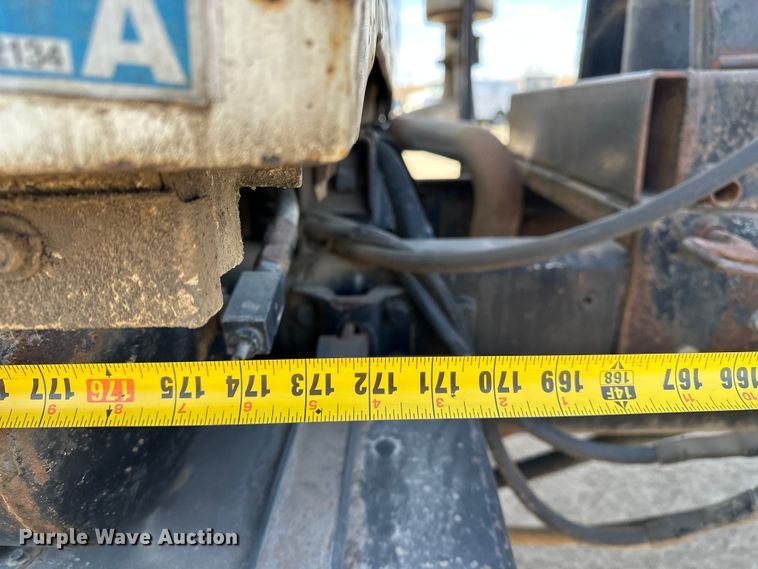 image for item ES1024 1985 Ford L7000 hook lift truck with tank