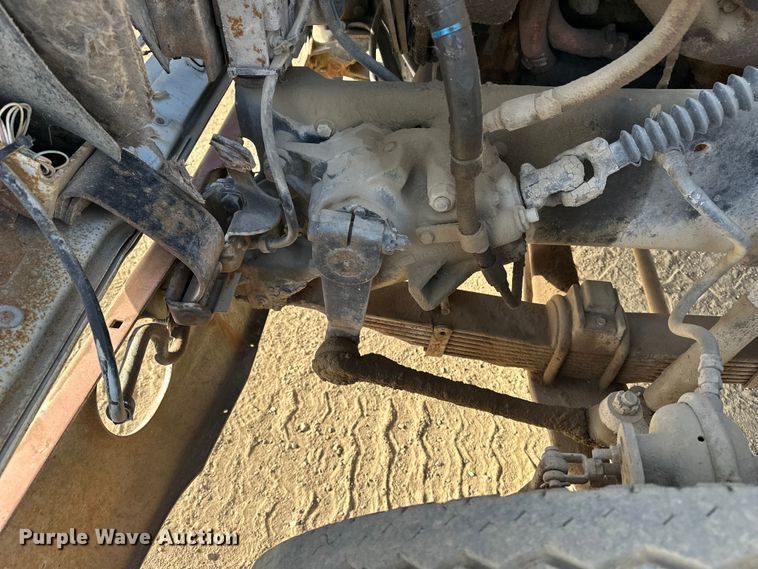 image for item ES1024 1985 Ford L7000 hook lift truck with tank