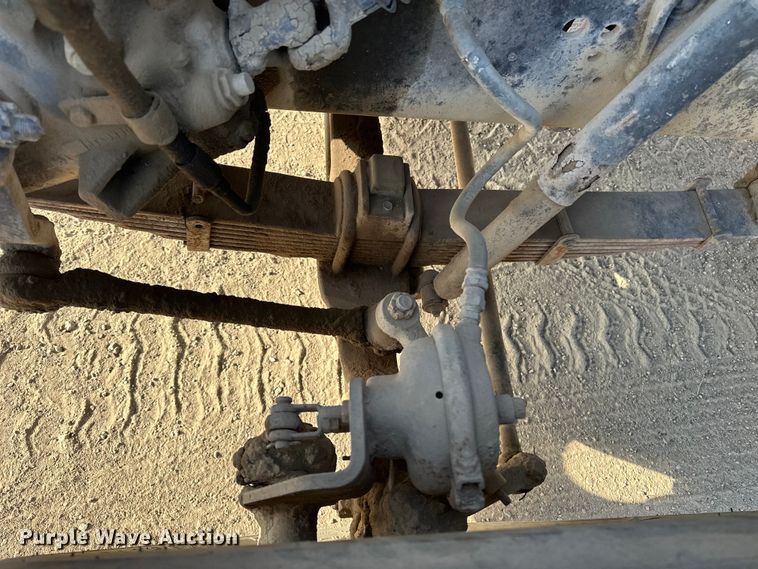 image for item ES1024 1985 Ford L7000 hook lift truck with tank