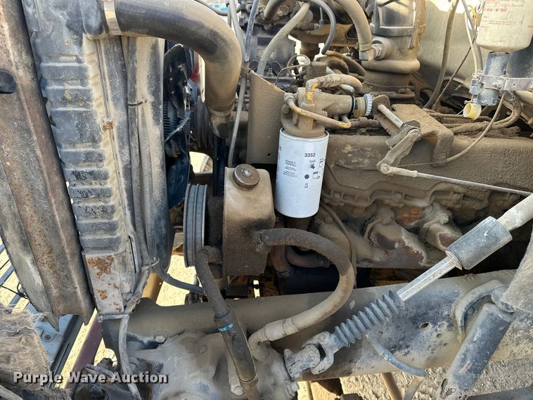 image for item ES1024 1985 Ford L7000 hook lift truck with tank