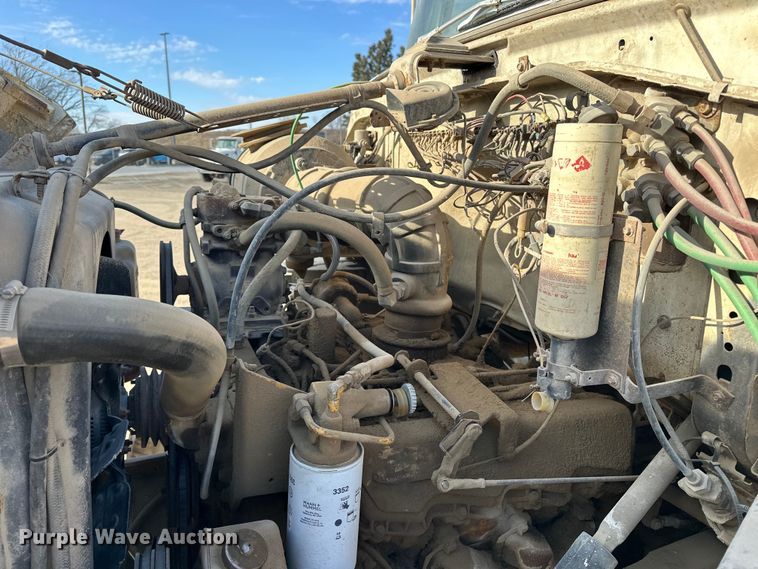 image for item ES1024 1985 Ford L7000 hook lift truck with tank