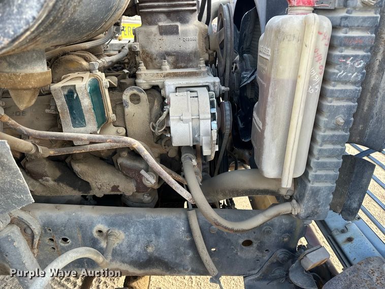 image for item ES1024 1985 Ford L7000 hook lift truck with tank