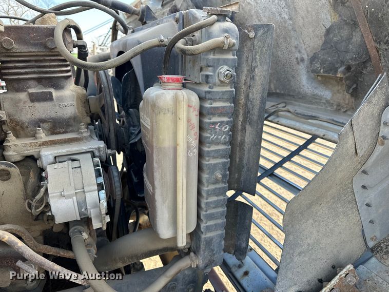 image for item ES1024 1985 Ford L7000 hook lift truck with tank