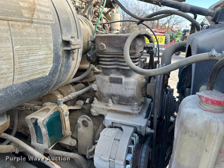 image for item ES1024 1985 Ford L7000 hook lift truck with tank