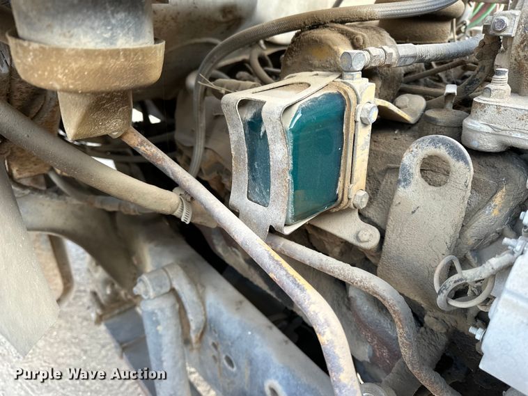 image for item ES1024 1985 Ford L7000 hook lift truck with tank