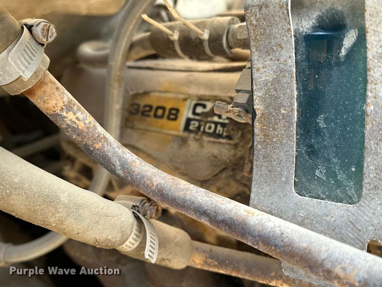 image for item ES1024 1985 Ford L7000 hook lift truck with tank