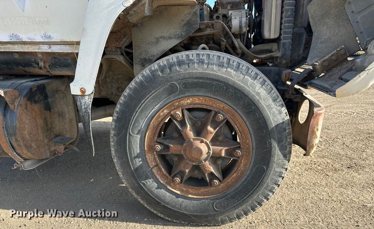 image for item ES1024 1985 Ford L7000 hook lift truck with tank