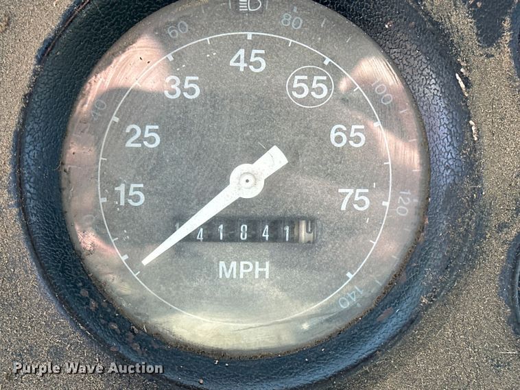 image for item ES1024 1985 Ford L7000 hook lift truck with tank