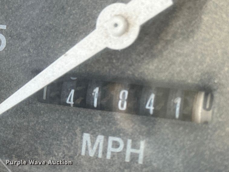 image for item ES1024 1985 Ford L7000 hook lift truck with tank