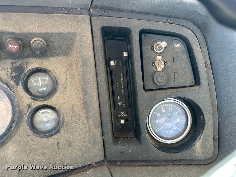 image for item ES1024 1985 Ford L7000 hook lift truck with tank