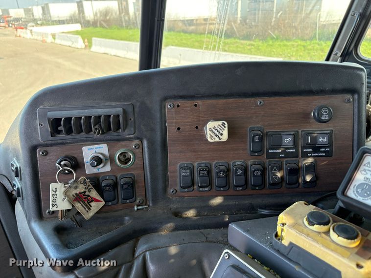 image for item EC8214 2013 Peterbilt 320 flatbed truck