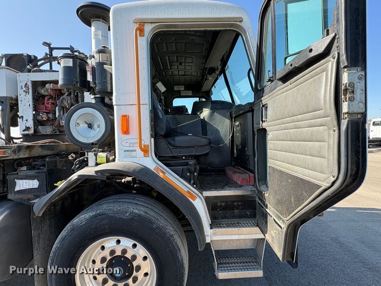 image for item EC8214 2013 Peterbilt 320 flatbed truck