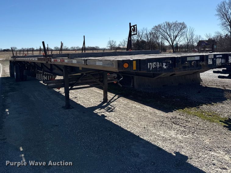 image for item EN0305 1999 Fontaine IPTW-6-8048WSAK flatbed trailer