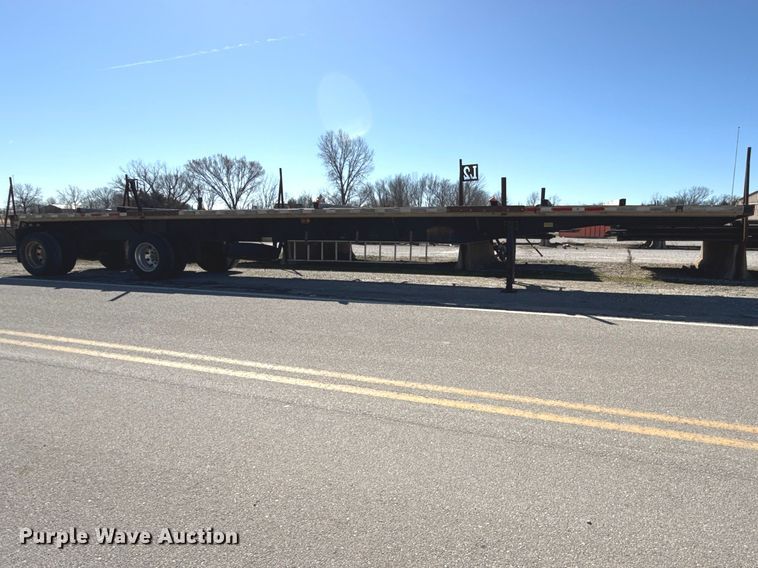 image for item EN0305 1999 Fontaine IPTW-6-8048WSAK flatbed trailer