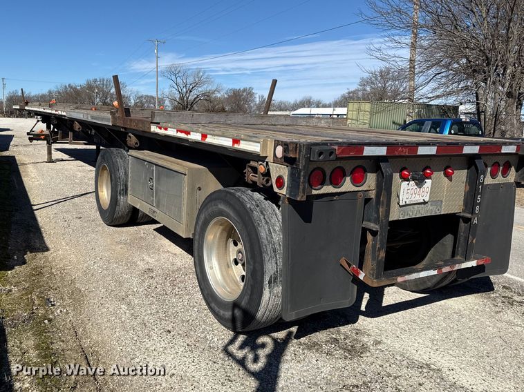 image for item EN0305 1999 Fontaine IPTW-6-8048WSAK flatbed trailer