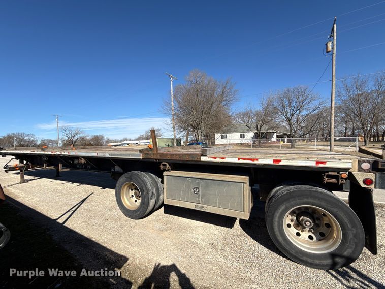 image for item EN0305 1999 Fontaine IPTW-6-8048WSAK flatbed trailer
