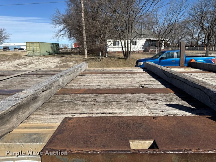 image for item EN0305 1999 Fontaine IPTW-6-8048WSAK flatbed trailer