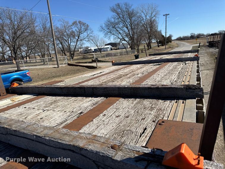 image for item EN0305 1999 Fontaine IPTW-6-8048WSAK flatbed trailer