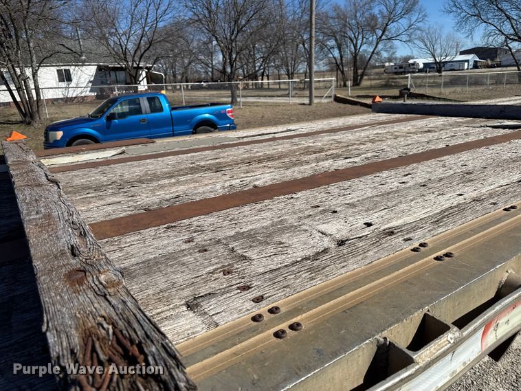 image for item EN0305 1999 Fontaine IPTW-6-8048WSAK flatbed trailer