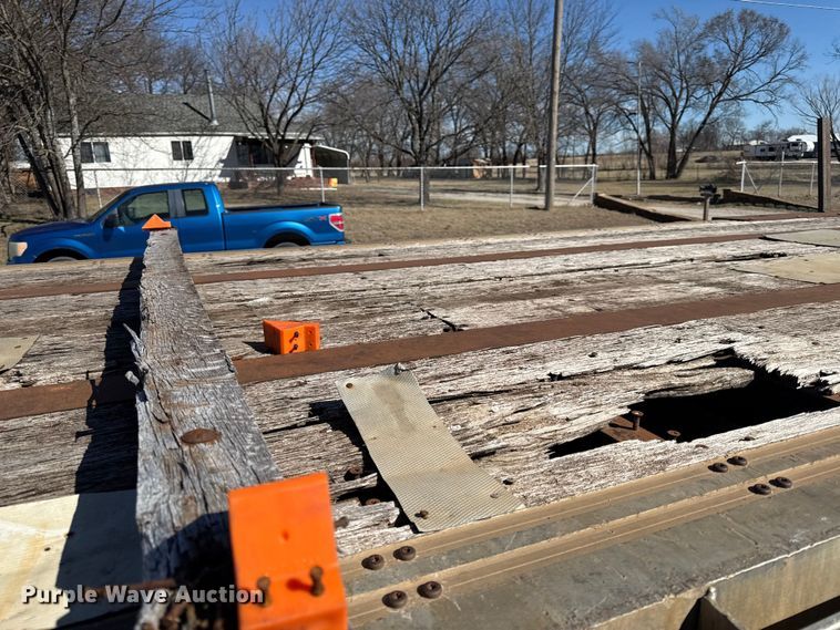 image for item EN0305 1999 Fontaine IPTW-6-8048WSAK flatbed trailer