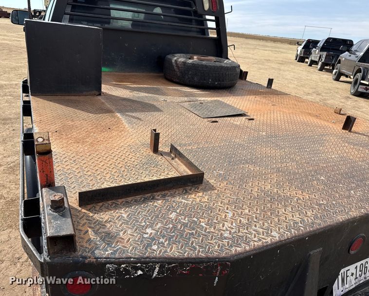 image for item DZ4991 2013 RAM 3500 Crew Cab flatbed pickup truck