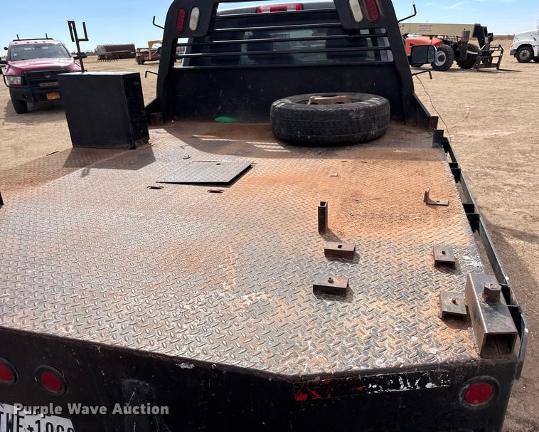 image for item DZ4991 2013 RAM 3500 Crew Cab flatbed pickup truck