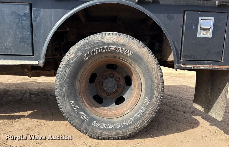 image for item DZ4991 2013 RAM 3500 Crew Cab flatbed pickup truck