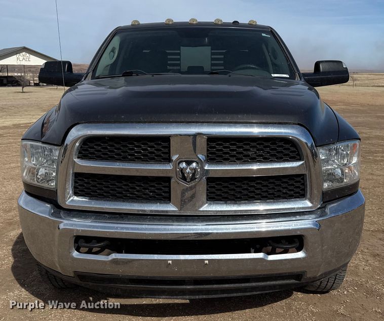 image for item DZ4992 2016 RAM 3500 Crew Cab flatbed pickup truck