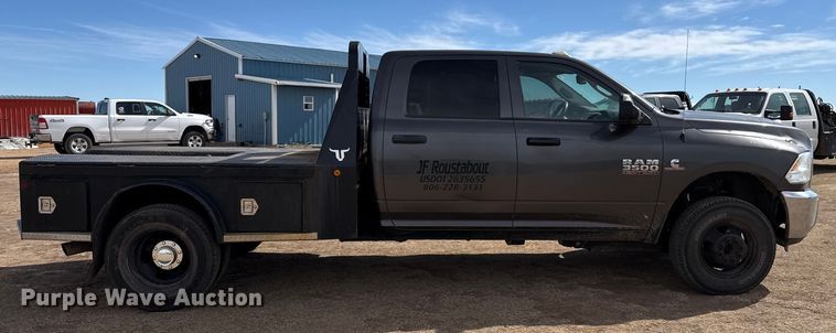 image for item DZ4992 2016 RAM 3500 Crew Cab flatbed pickup truck