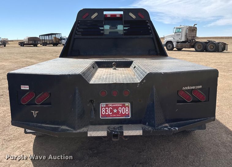 image for item DZ4992 2016 RAM 3500 Crew Cab flatbed pickup truck