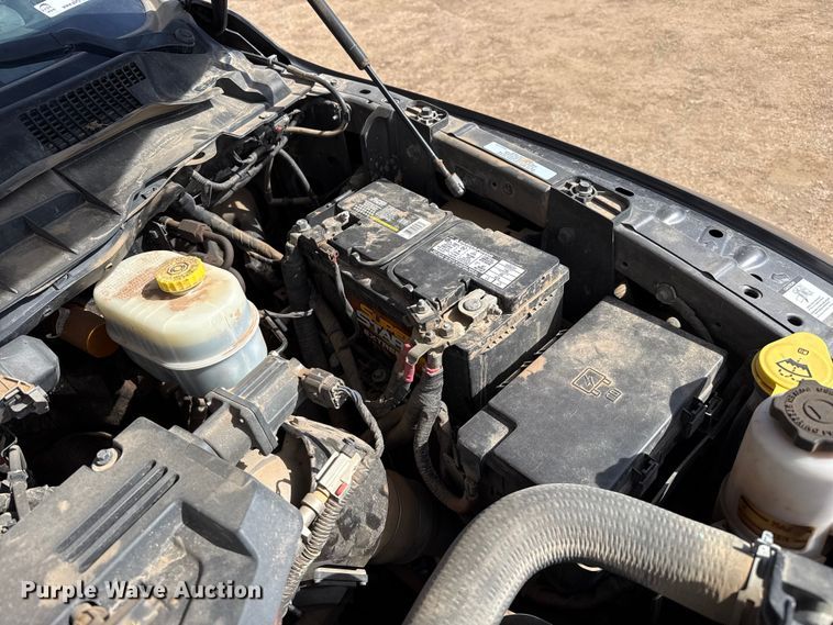 image for item DZ4992 2016 RAM 3500 Crew Cab flatbed pickup truck