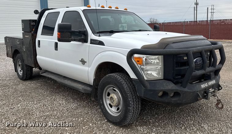 image for item ET1551 2015 Ford F350 Crew Cab flatbed pickup truck
