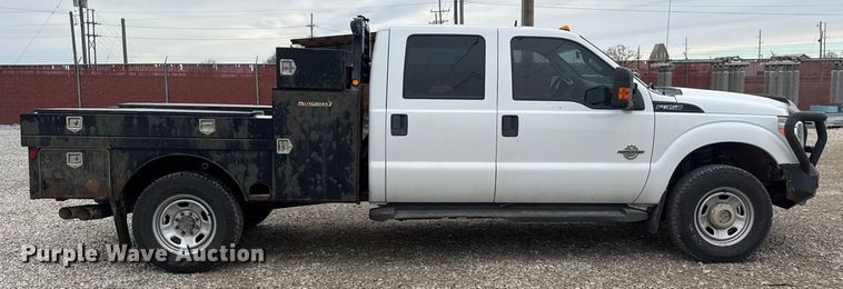 image for item ET1551 2015 Ford F350 Crew Cab flatbed pickup truck