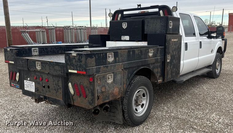 image for item ET1551 2015 Ford F350 Crew Cab flatbed pickup truck