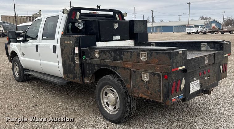 image for item ET1551 2015 Ford F350 Crew Cab flatbed pickup truck