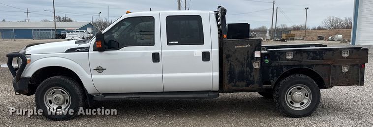 image for item ET1551 2015 Ford F350 Crew Cab flatbed pickup truck