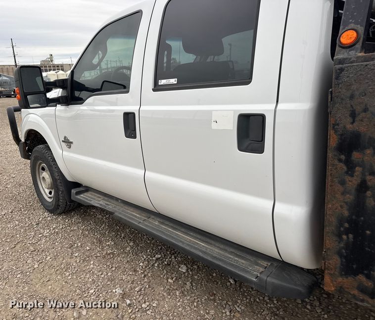 image for item ET1551 2015 Ford F350 Crew Cab flatbed pickup truck