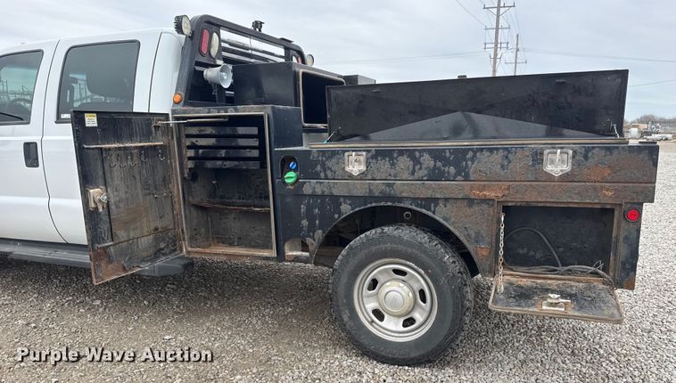 image for item ET1551 2015 Ford F350 Crew Cab flatbed pickup truck