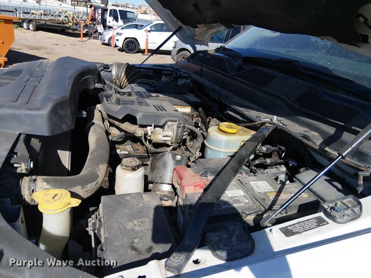 image for item EU2634 2020 RAM 3500 Crew Cab flatbed pickup truck