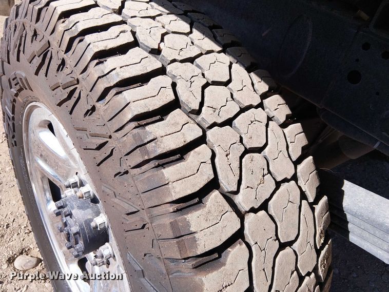 image for item EU2634 2020 RAM 3500 Crew Cab flatbed pickup truck