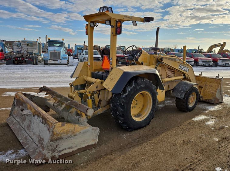 image for item EB1317 2000 John Deere 210LE landscape tractor