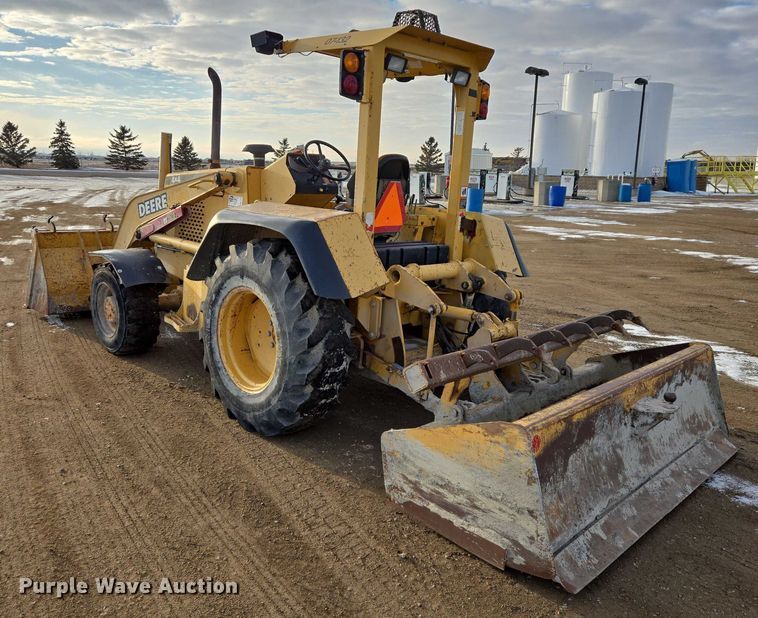 image for item EB1317 2000 John Deere 210LE landscape tractor