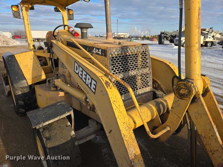 image for item EB1317 2000 John Deere 210LE landscape tractor