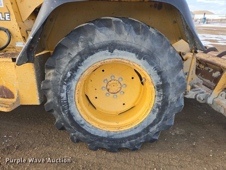 image for item EB1317 2000 John Deere 210LE landscape tractor