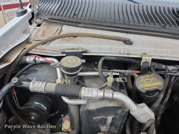 image for item FI0902 2011 Ford E350 Super Duty shuttle bus