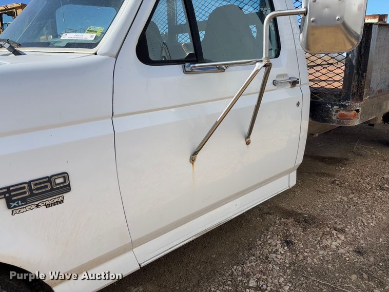 image for item FB3144 1997 Ford F350 flatbed pickup truck