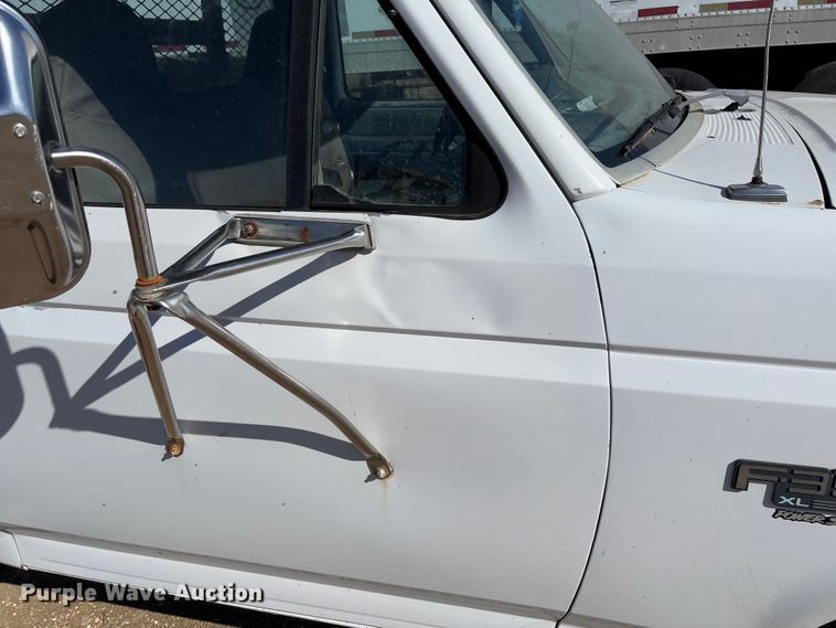 image for item FB3144 1997 Ford F350 flatbed pickup truck